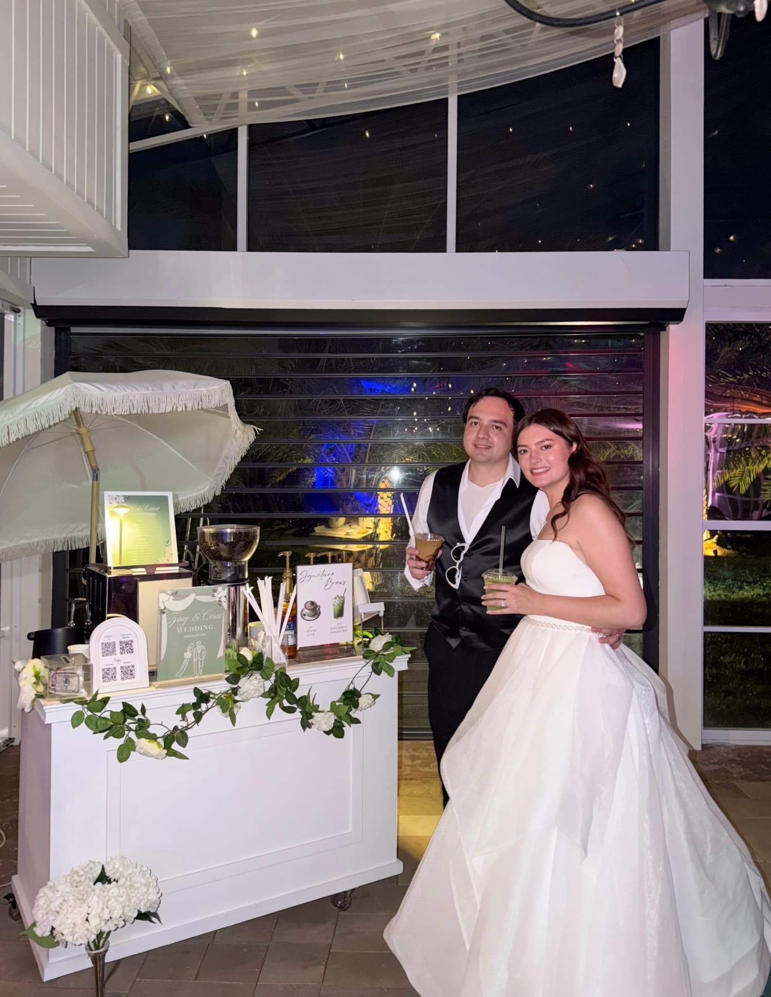 Wedding couple standing near a Reyes Coffee & Catering event setup